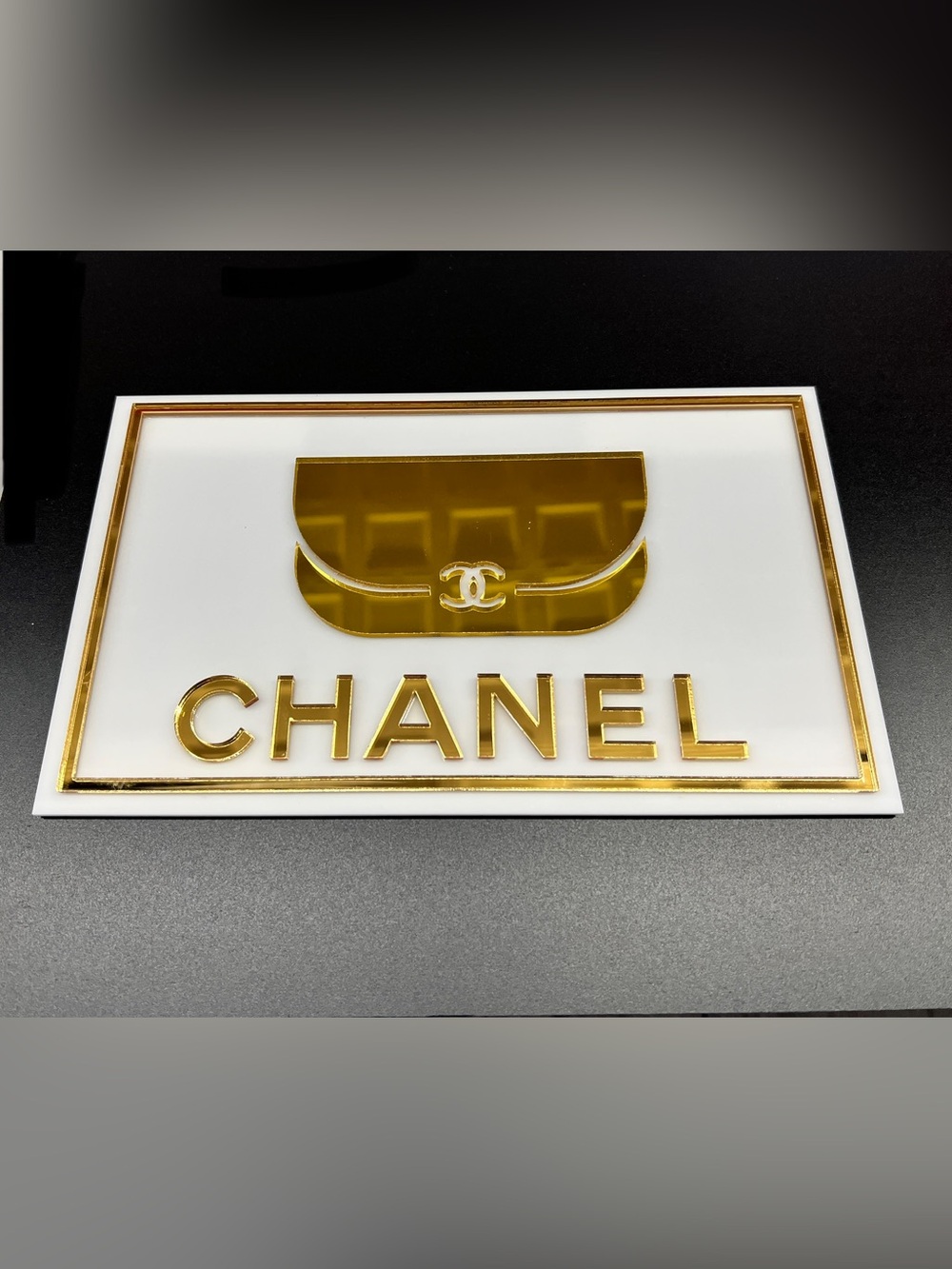 Custom Acrylic CHANEL Gold Logo Plaque on White Acrylic